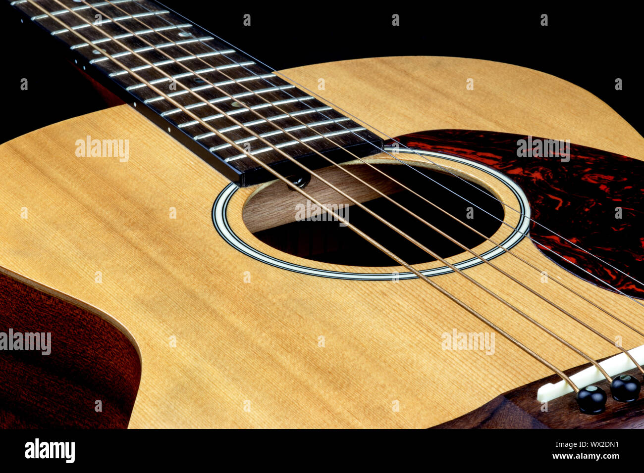 Oblique view of acoustic folk guitar top Stock Photo