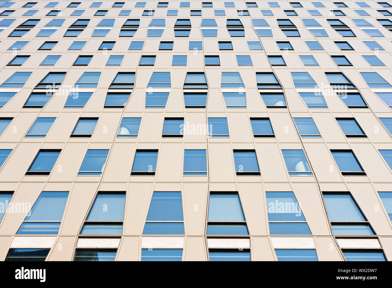 Facade of a modern office building with symmetric glass windows Stock ...