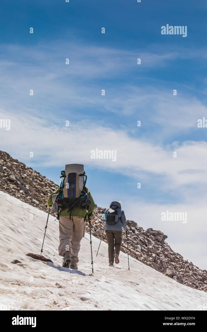 Crossing a snow field along the Pacific Crest Trail below Old Snowy in the Goat Rocks Wilderness, Gifford Pinchot National Forest, Washington State, U Stock Photo