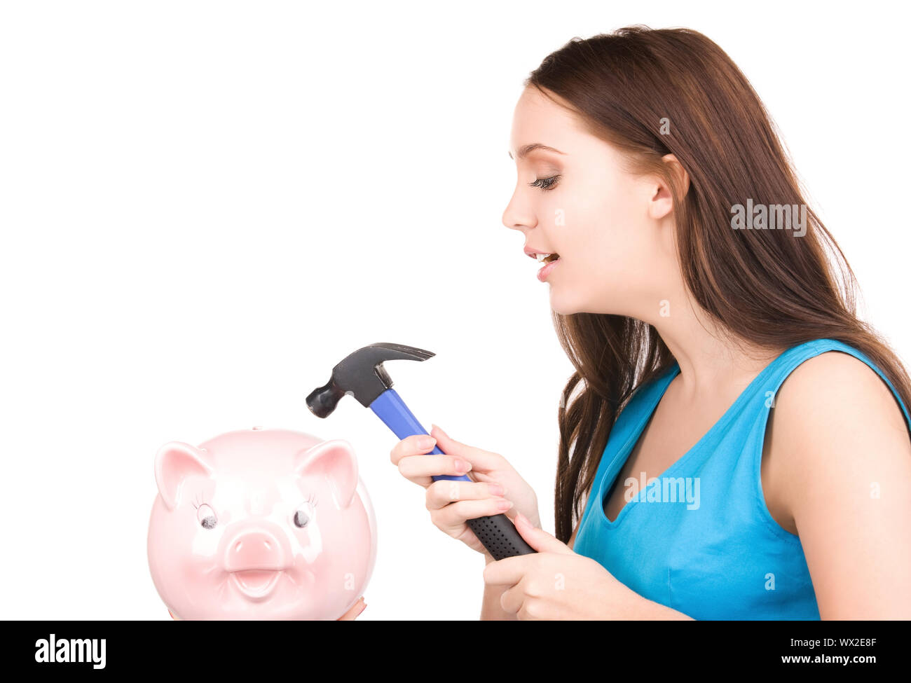 lovely teenage girl with piggy bank and hammer Stock Photo - Alamy