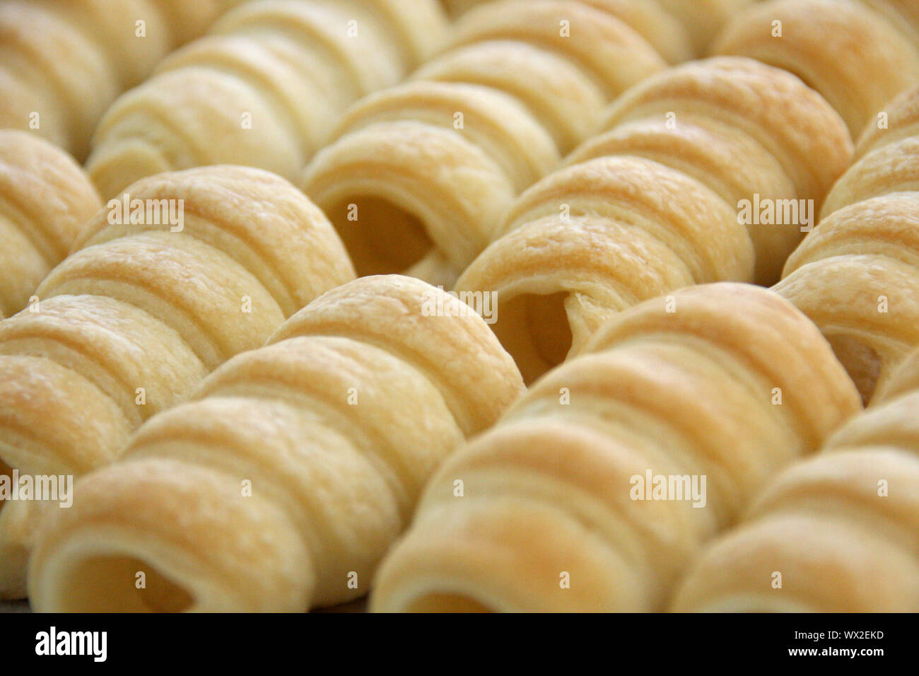 Foam rolls austrian Schaumrollen or Schillerlocken unfilled puff pastry rolls for sweet dessert Stock Photo