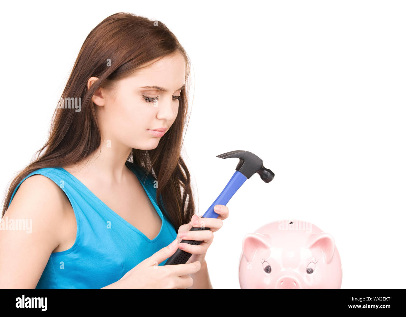 lovely teenage girl with piggy bank and hammer Stock Photo - Alamy