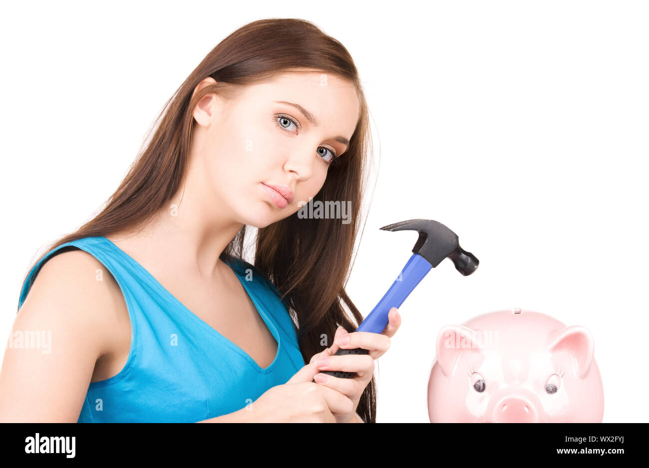 lovely teenage girl with piggy bank and hammer Stock Photo - Alamy