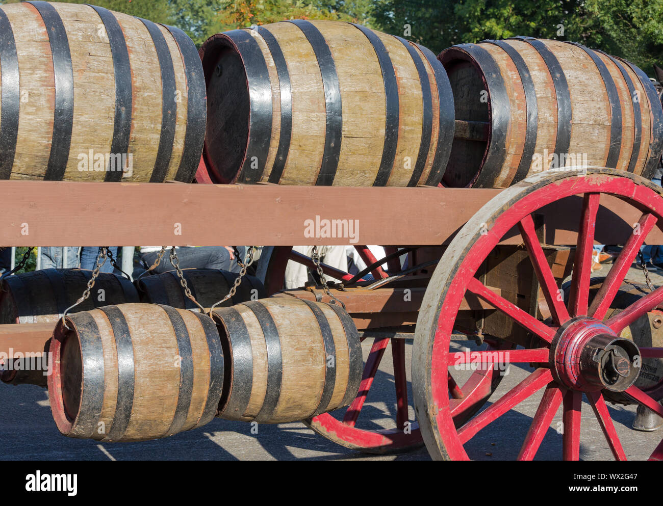 Wooden barrels at an old farm wagon in a countryside parade Stock Photo