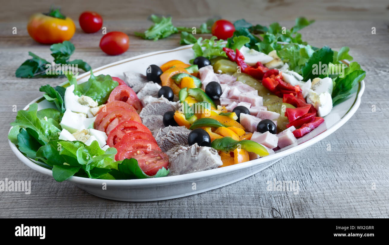 Cobb salad on the table on a platter. Stock Photo