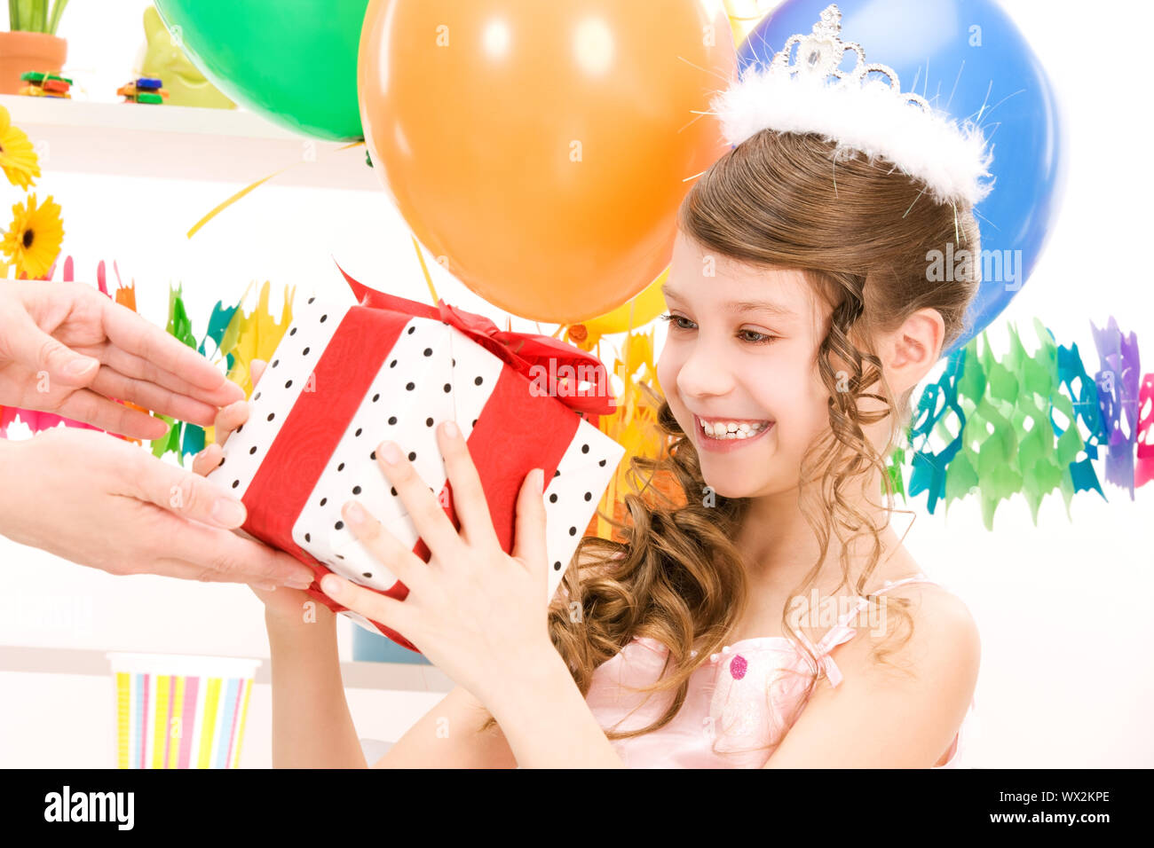 happy party girl with balloons and gift box Stock Photo - Alamy