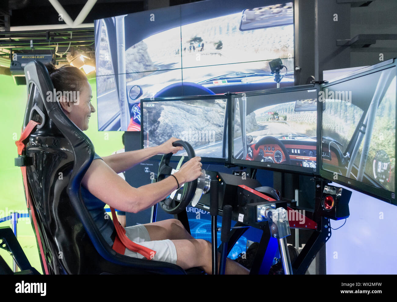 Woman using Rally/Formula 1 simulator in science and technology museum in Las Palmas on Gran Canaria,Canary Islands, Spain Stock Photo