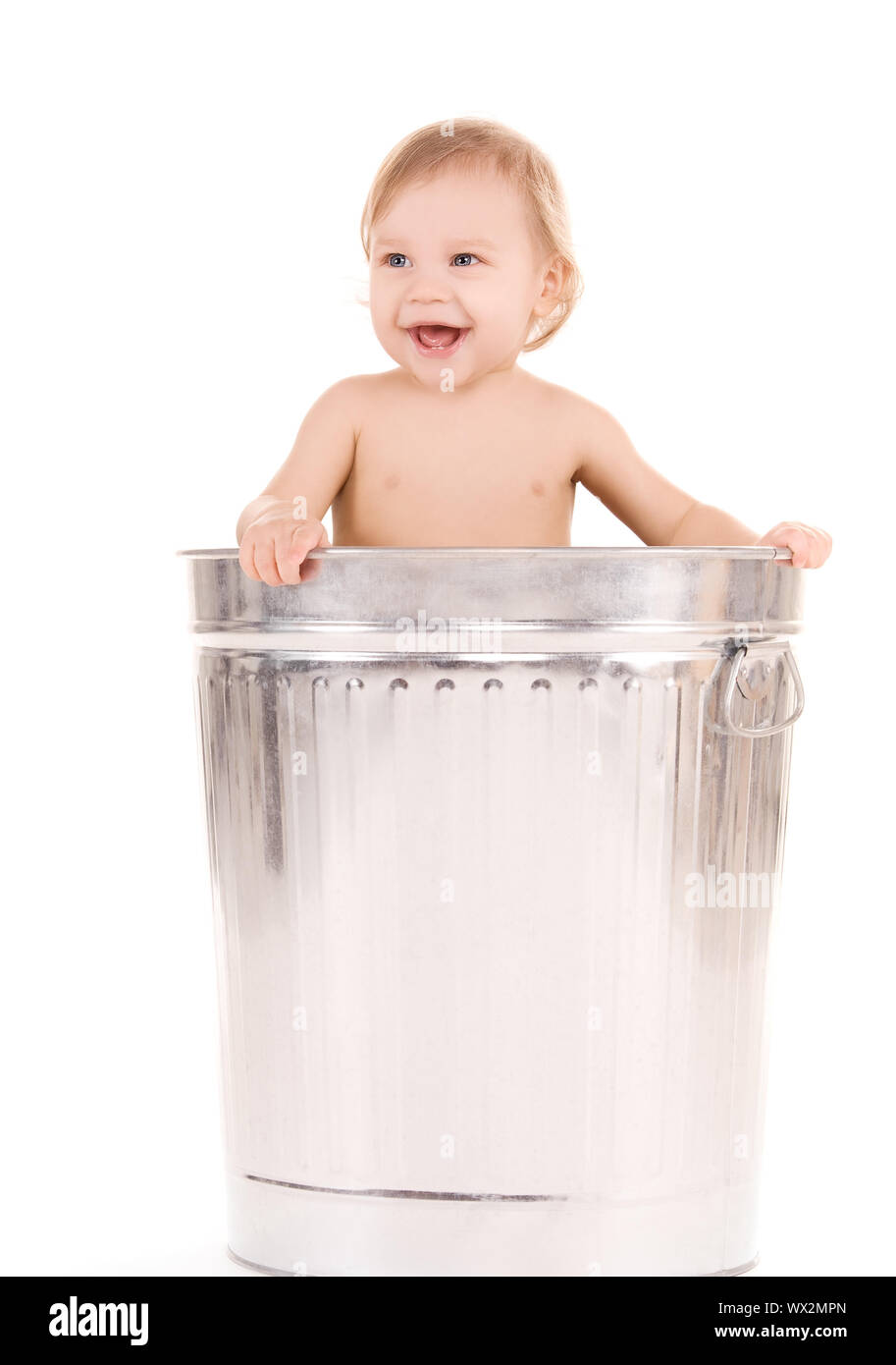 baby in trash can Stock Photo