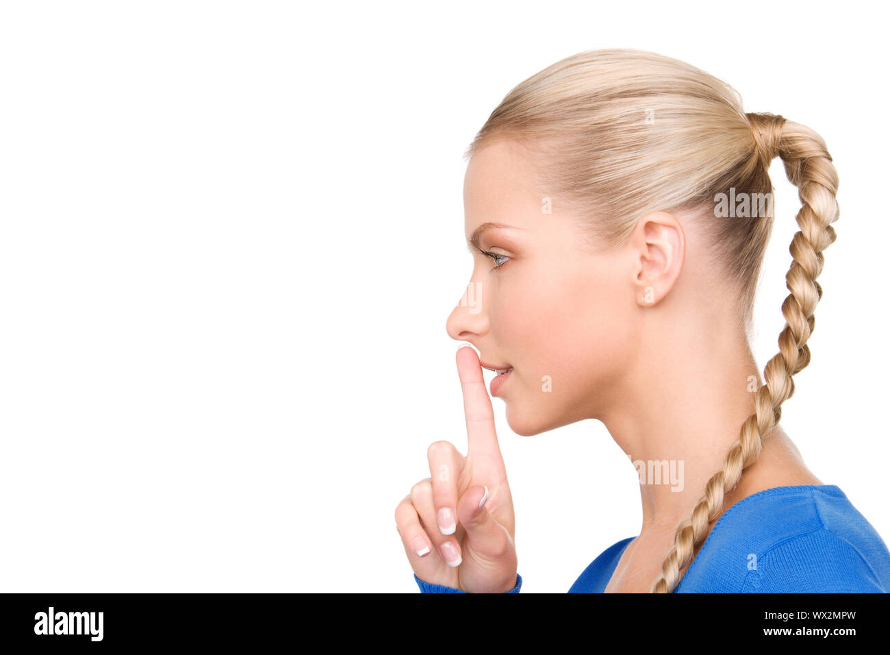 bright picture of teenage girl with finger on lips Stock Photo - Alamy