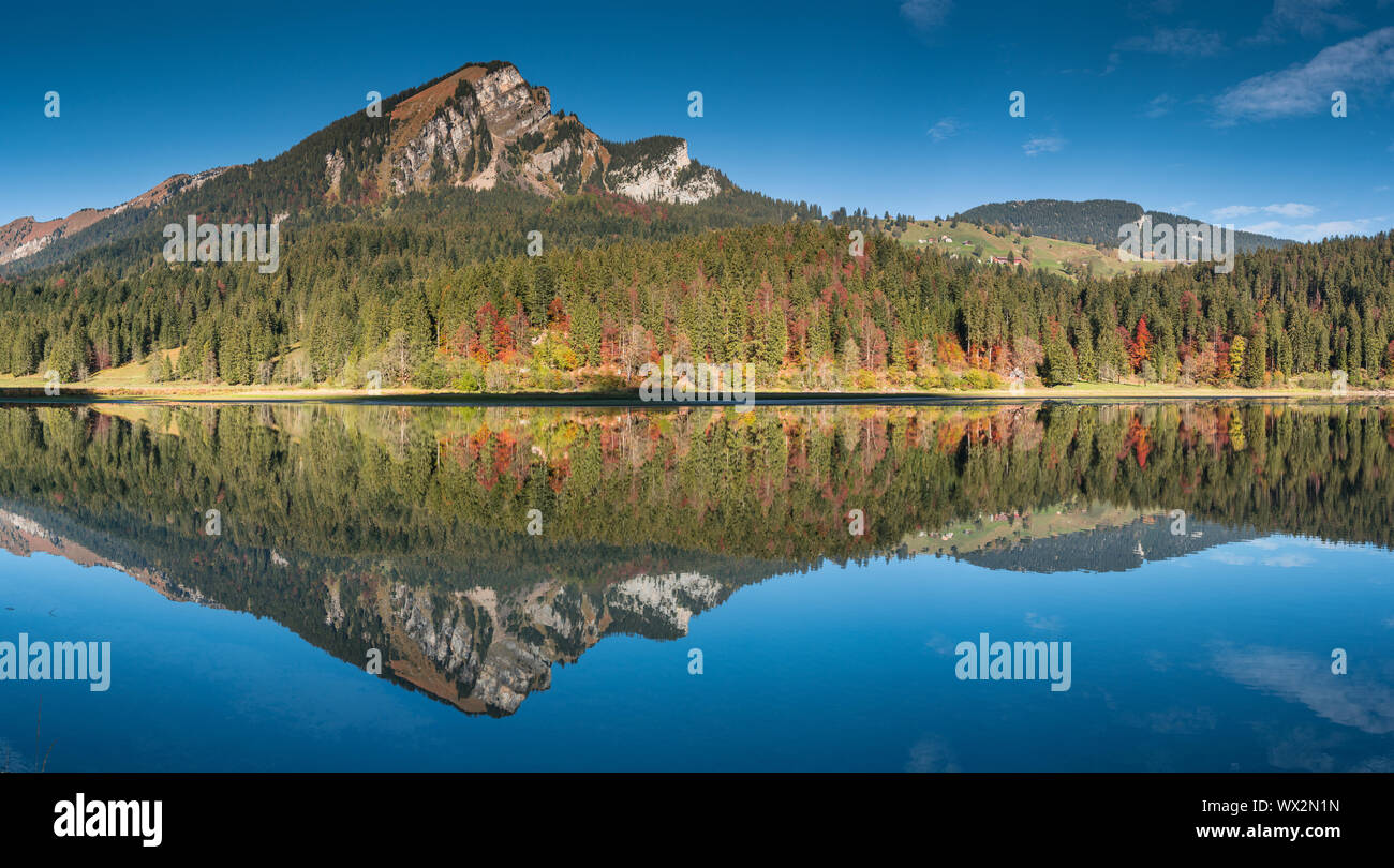 autumn color mountain landscape and lake in the Swiss Alps Stock Photo