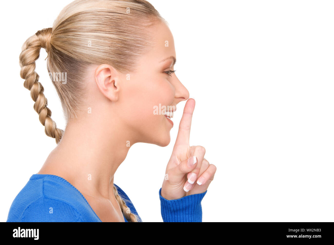 bright picture of teenage girl with finger on lips Stock Photo - Alamy