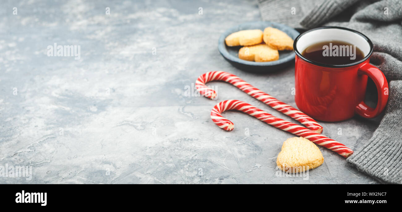 Yummy christmas cookies and a mug of hot tea, christmas time Stock Photo