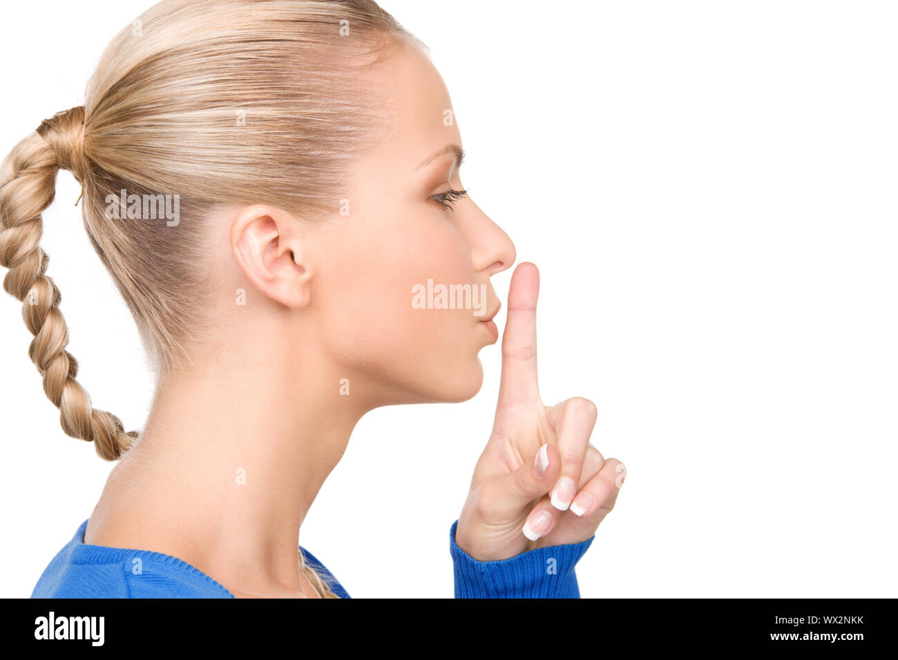 bright picture of teenage girl with finger on lips Stock Photo - Alamy