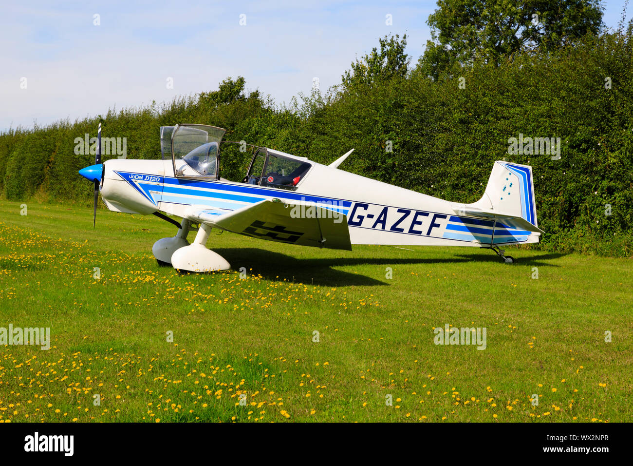 Vintage French Societe Wassmer Aviation Jodel D120, Paris-Nice parked on a grass airfield. Stock Photo