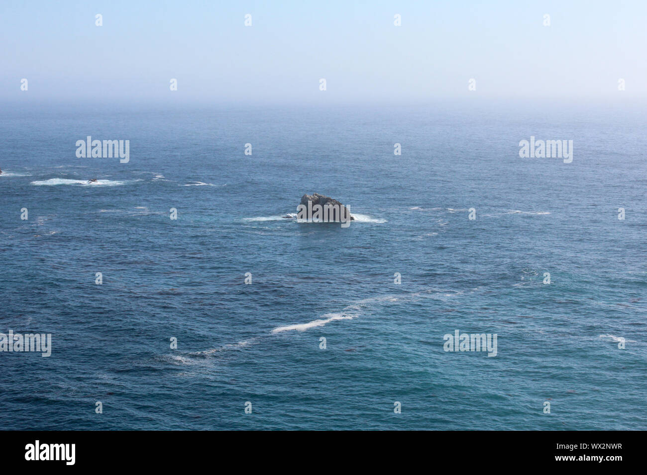Small rock island in the Pacific Ocean close to Pacific Coast Highway, California, USA Stock Photo