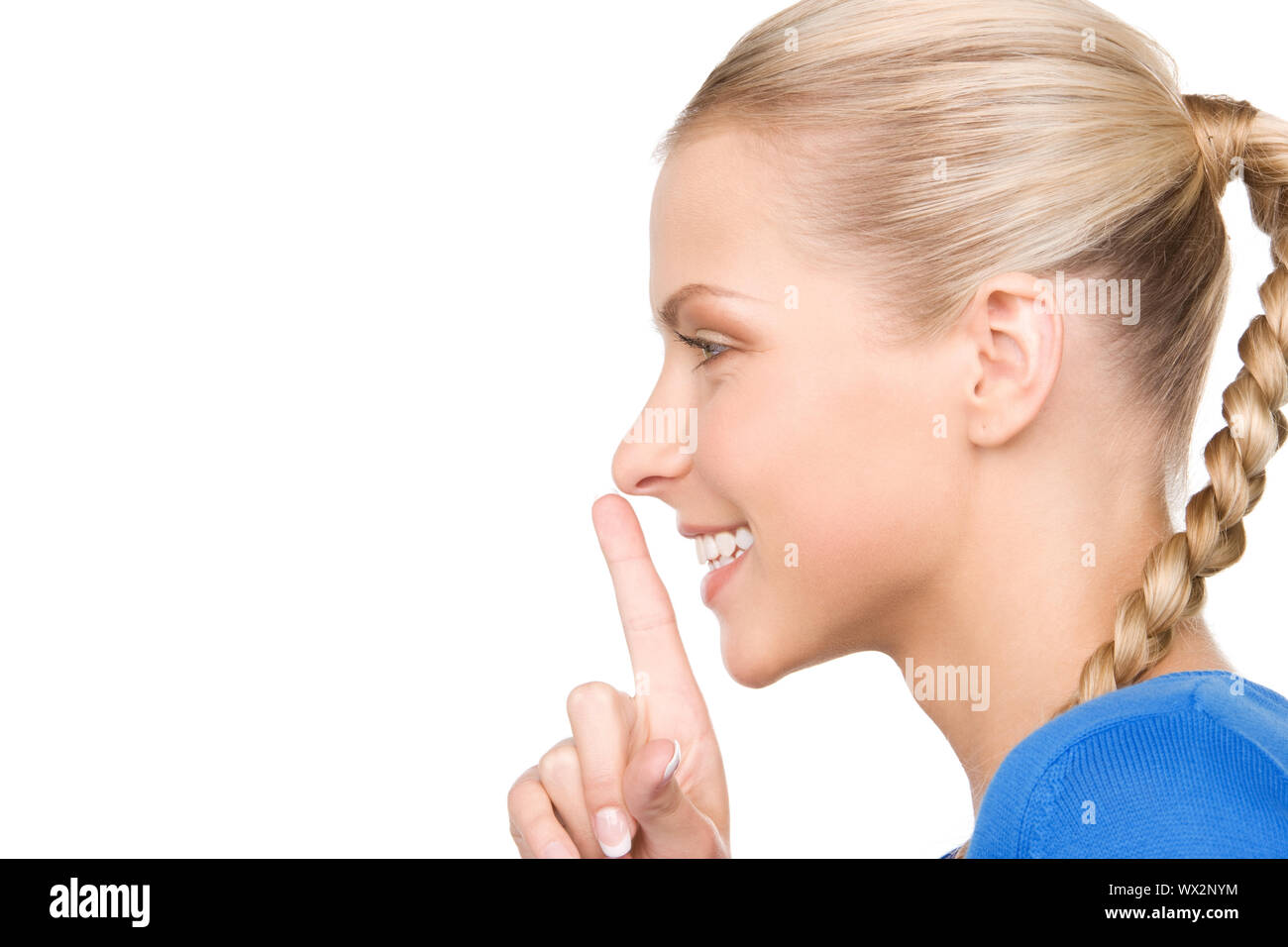 bright picture of teenage girl with finger on lips Stock Photo - Alamy