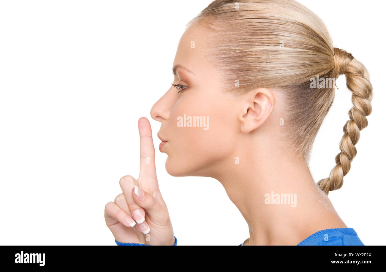 bright picture of teenage girl with finger on lips Stock Photo - Alamy