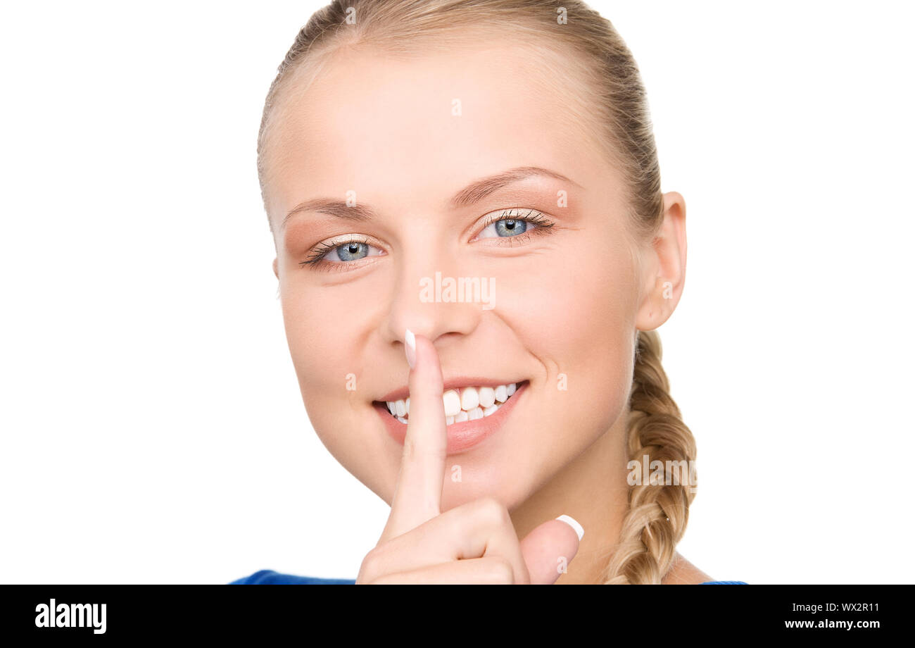 bright picture of teenage girl with finger on lips Stock Photo - Alamy