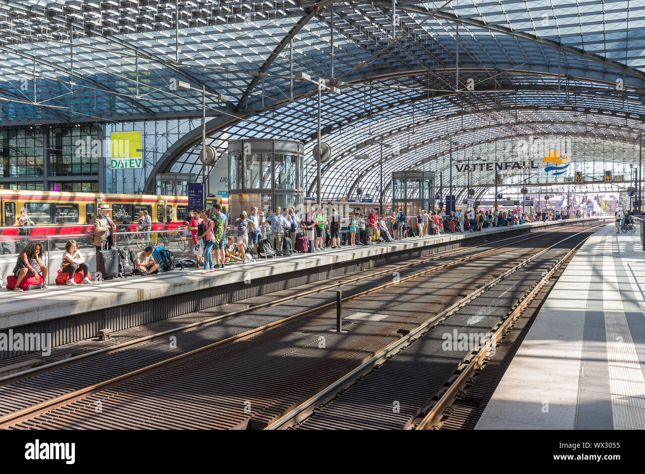 Workers are waiting for the train at central station Berlin Stock Photo