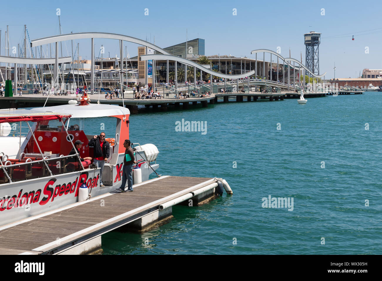 Harbor Barcelona with tourists and a tourist vessel Stock Photo