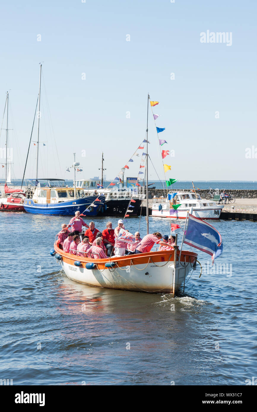 Tourist vessel with the members of a traditional sailors choir Stock Photo