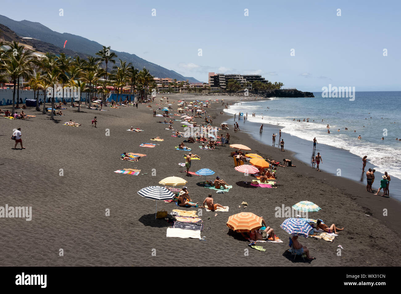 Sunbathing people at beach La Palma Island, Spain Stock Photo