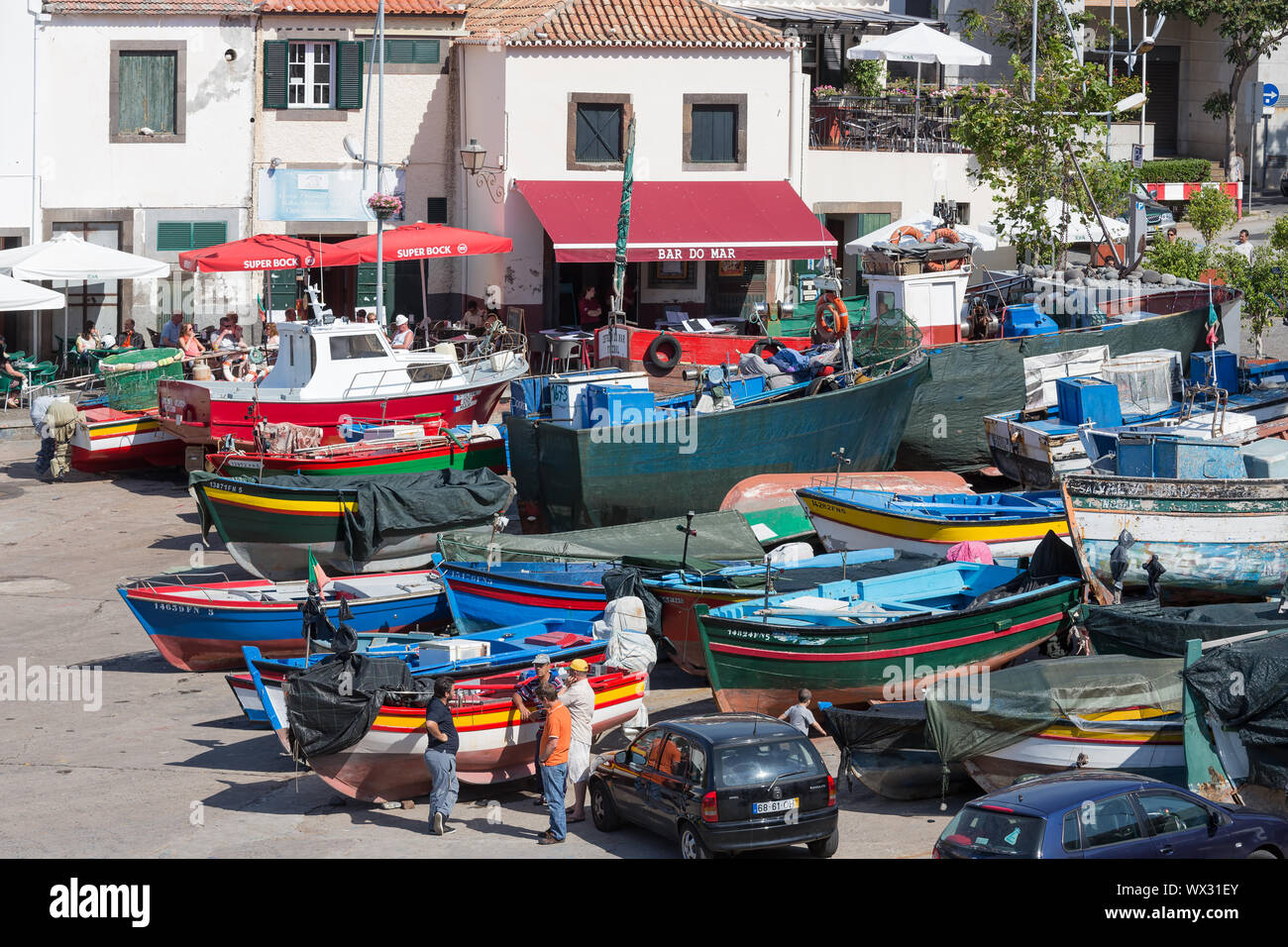 Harbor with fishermen and fishing ships in Funchal, Portugal Stock Photo