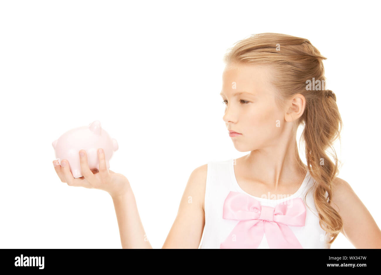 lovely teenage girl with piggy bank Stock Photo