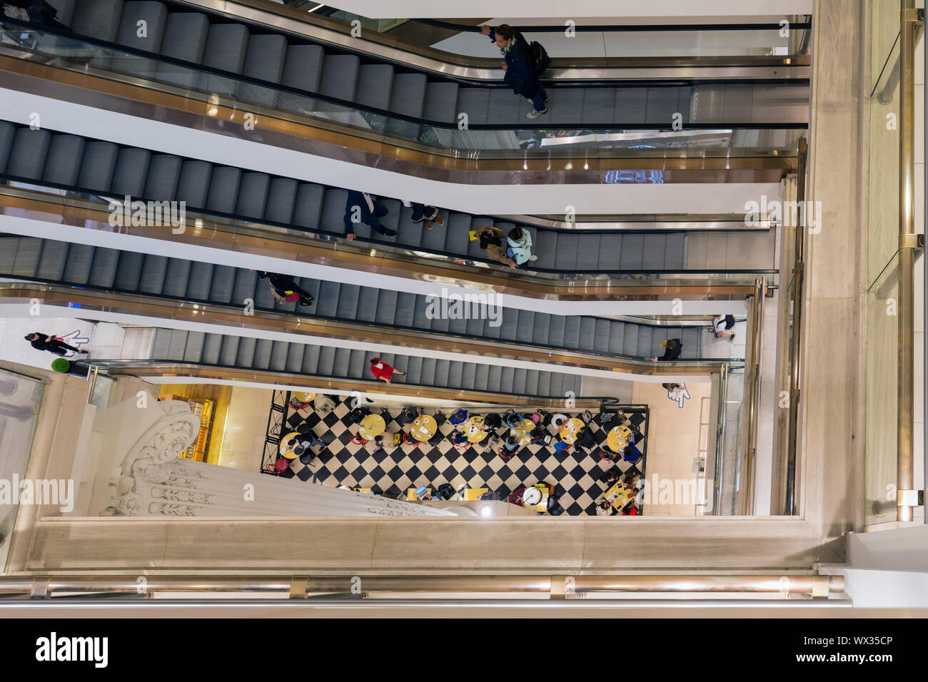 Stairwell with shopping people in Selfridges department store London Stock Photo