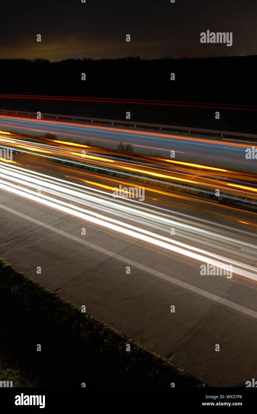highway at night with car traffic and lights Stock Photo