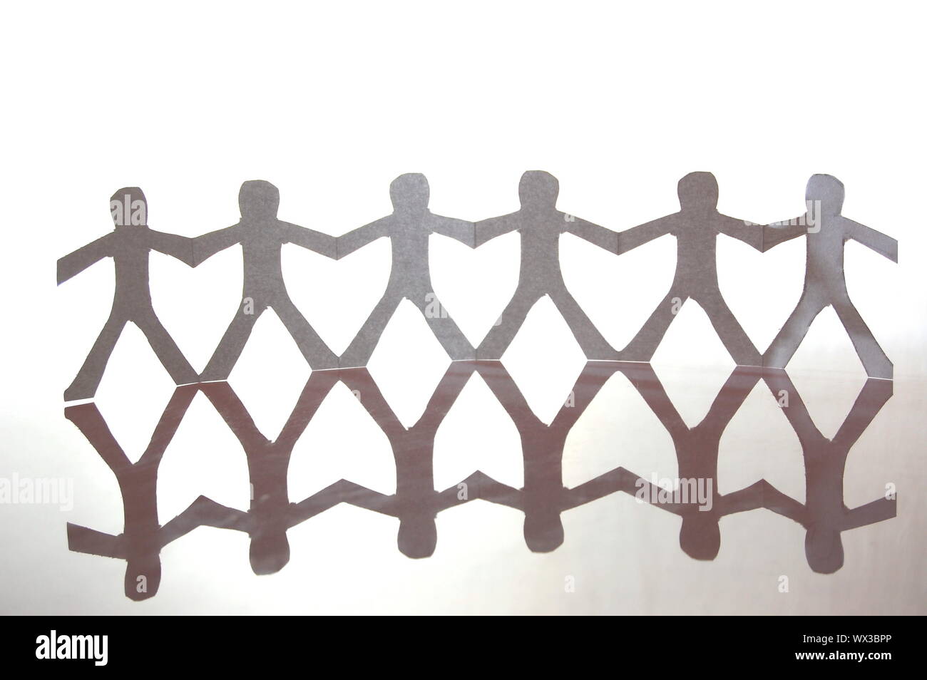 team of paper man showing concept of teamwork Stock Photo Alamy