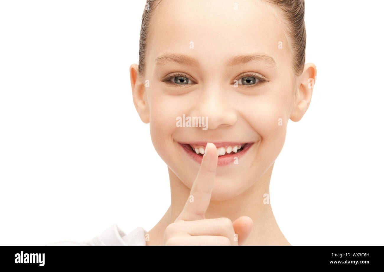 bright picture of teenage girl with finger on lips Stock Photo - Alamy