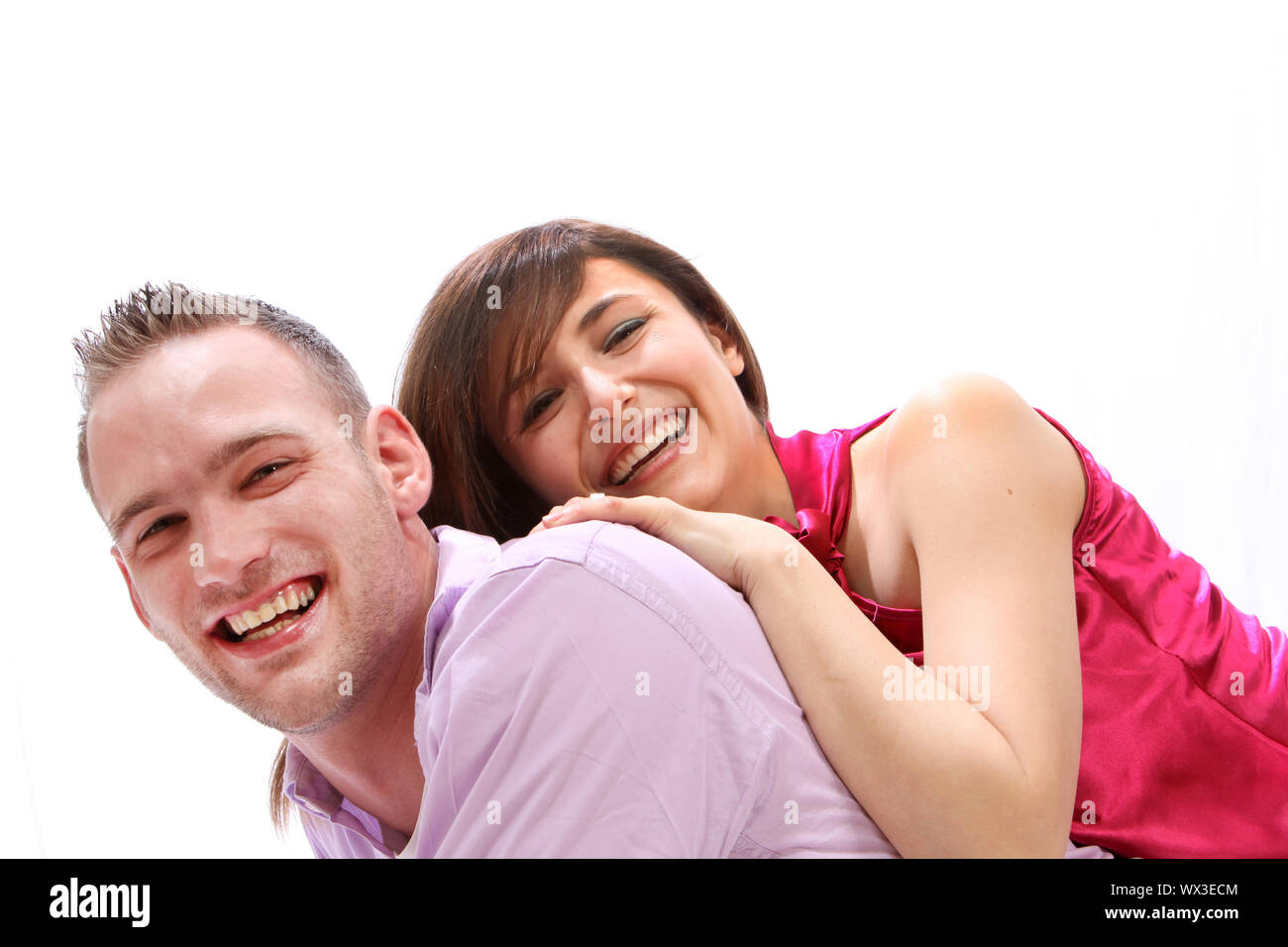 Young, smiling couple. He wears them on his back Stock Photo