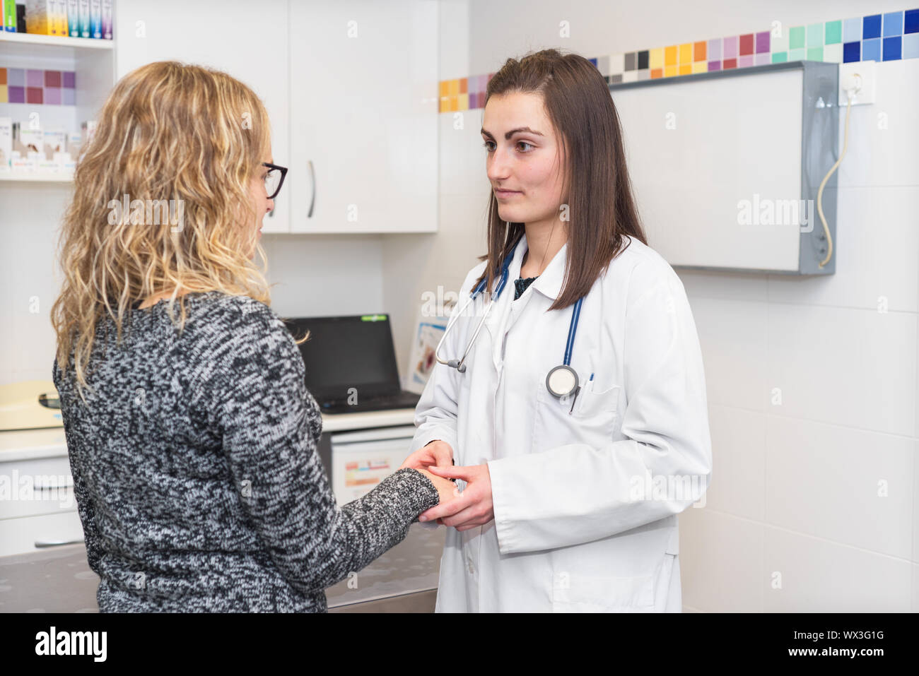 Doctor holding patient's hands, helping and empathy concept. Stock Photo