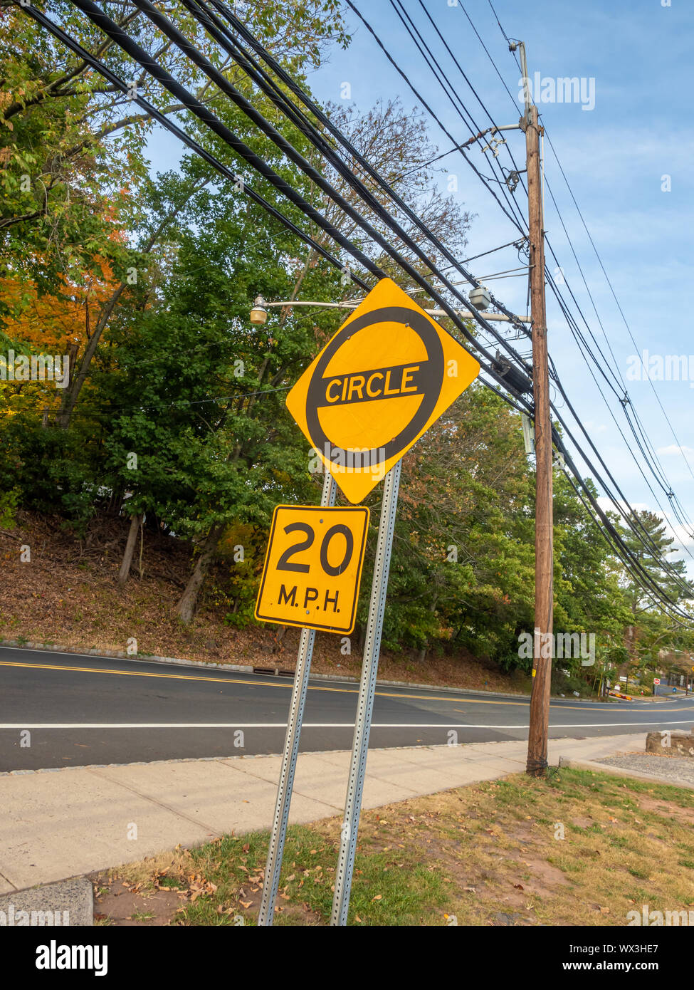 yellow circle and 20 mph traffic signs by the side of the road in North ...