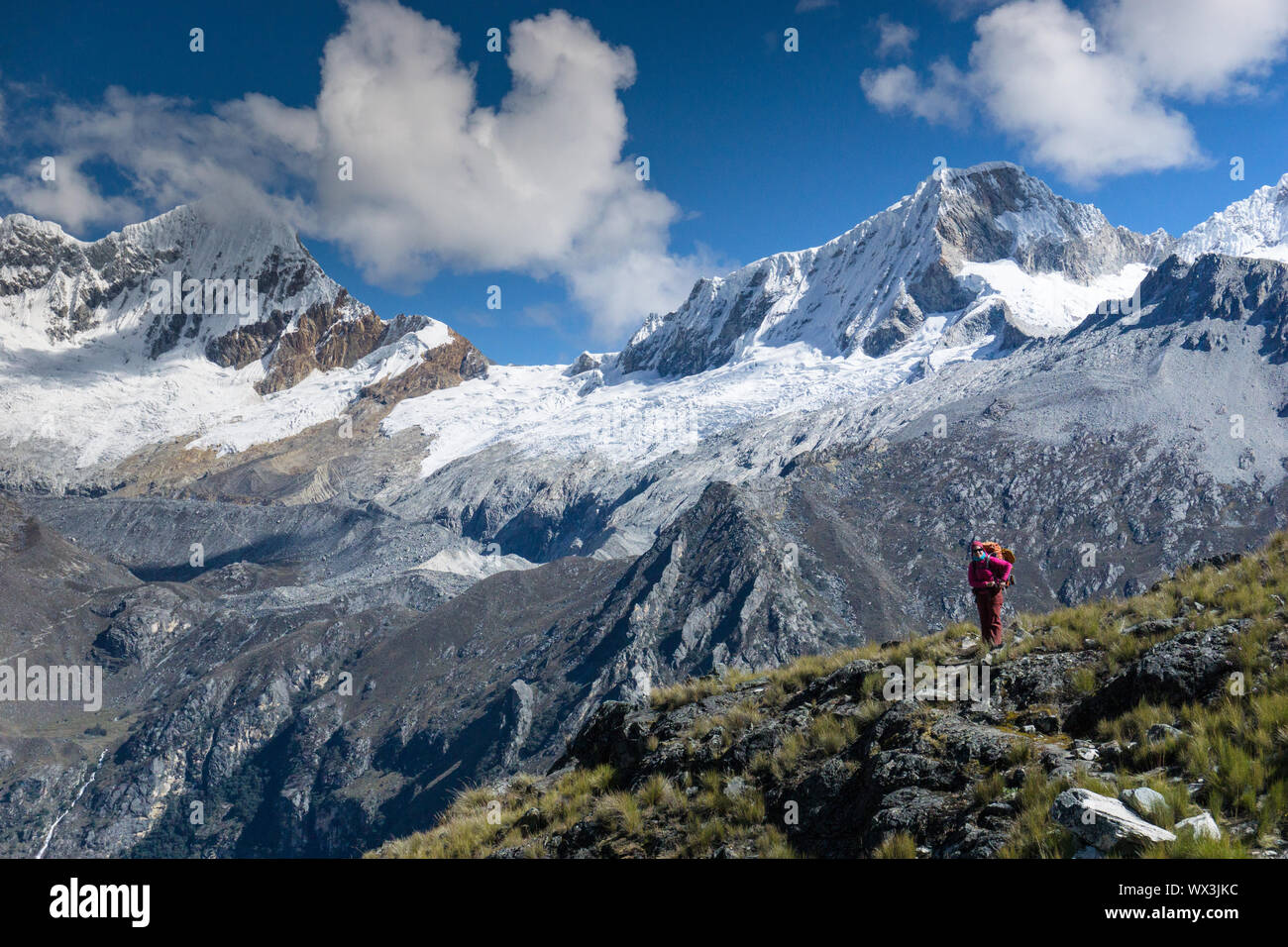 female backpacker in mountain landscape in the Andes of Peru Stock Photo