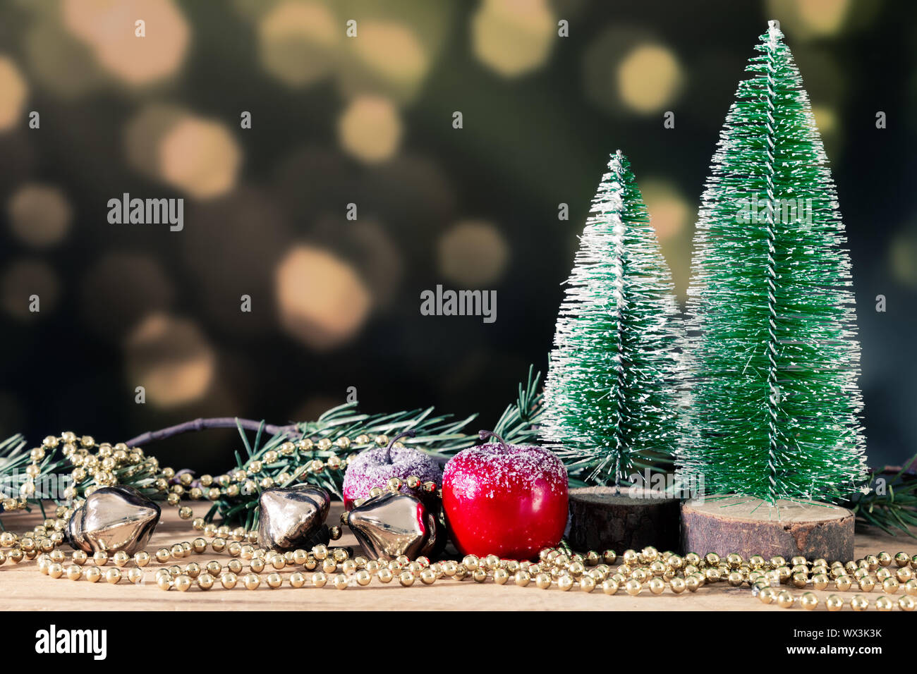 Christmas decoration green background with fir trees golden perls and ...