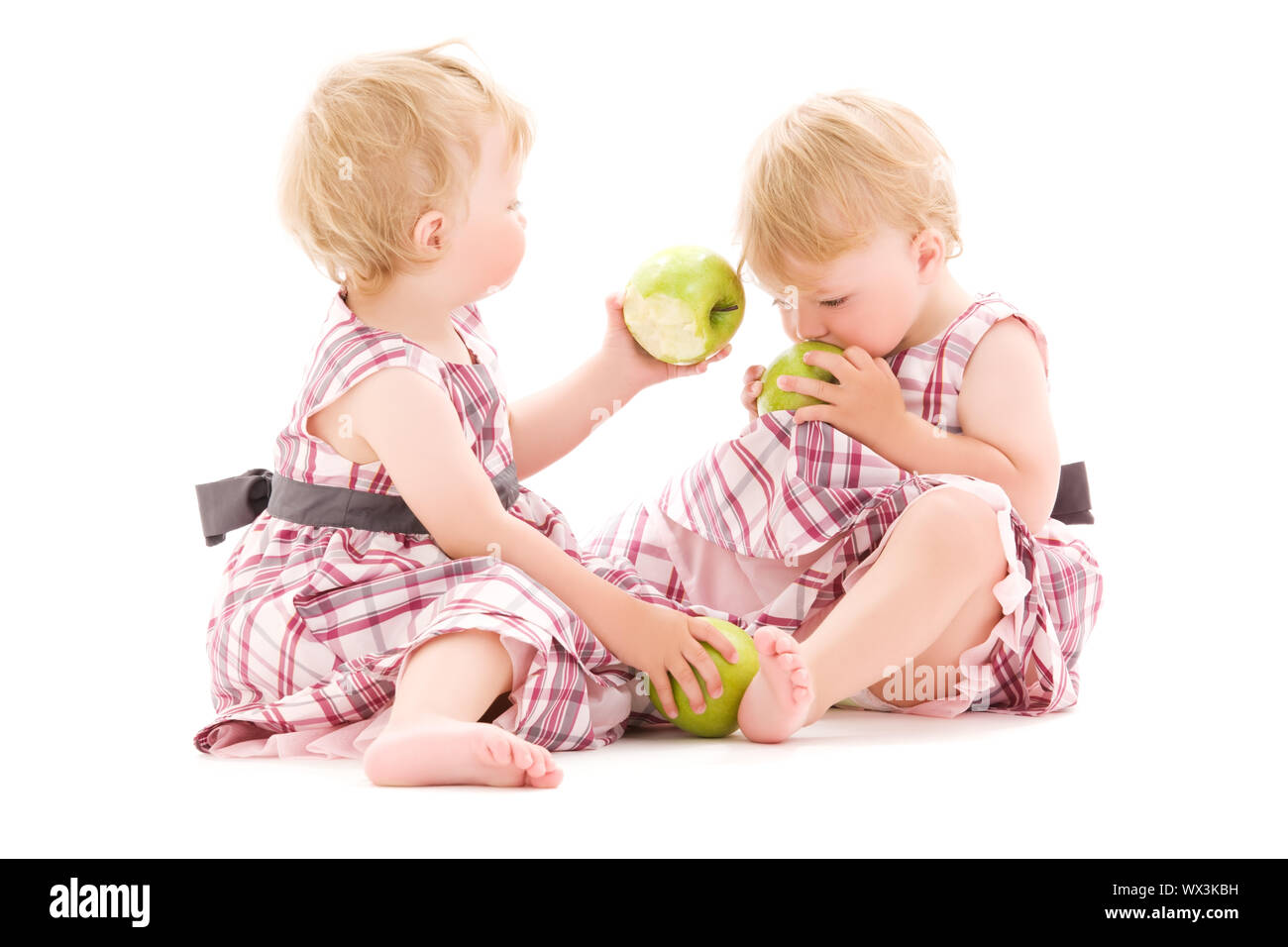 picture of two adorable twins over white Stock Photo