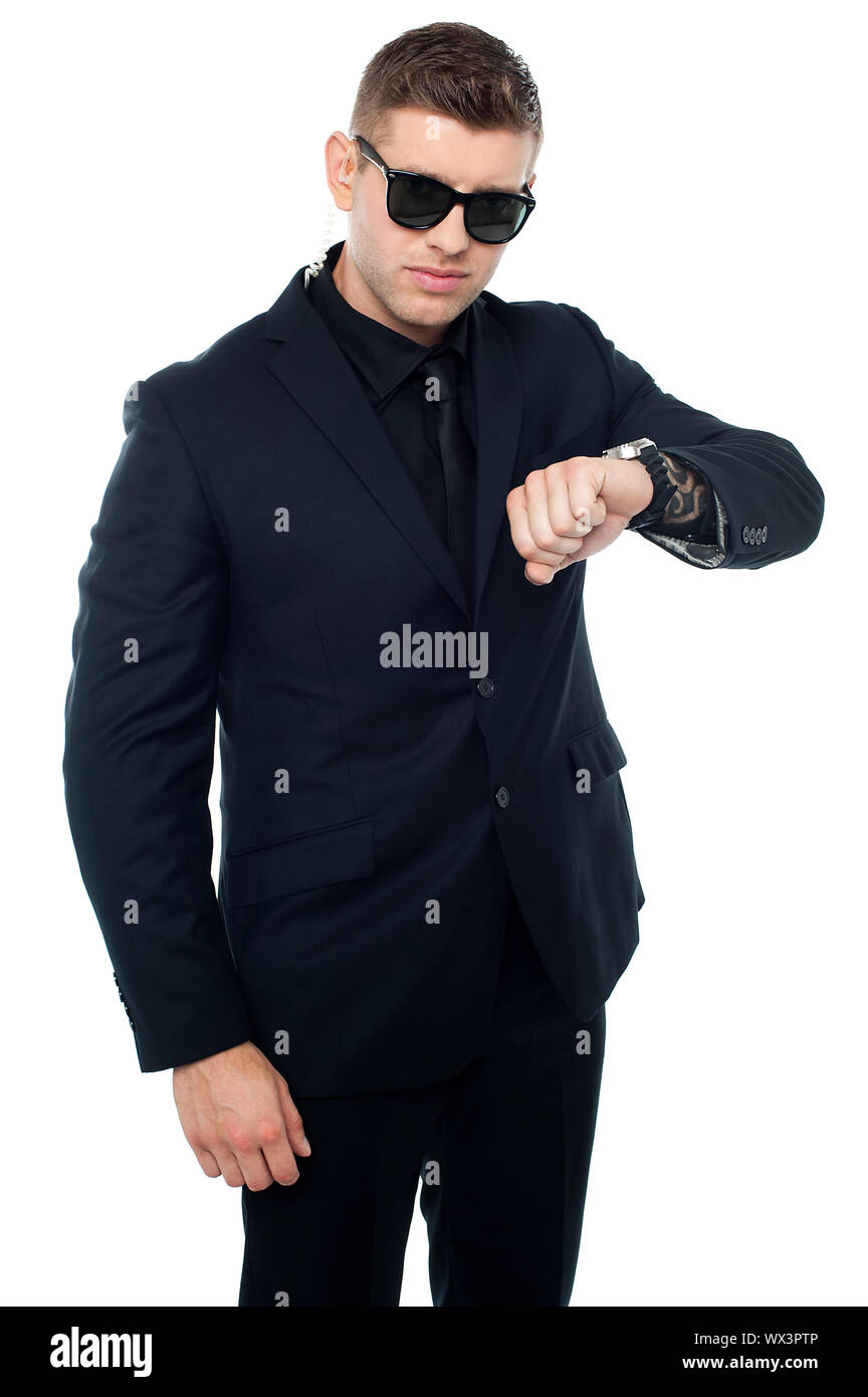 Tough security officer in black suit. Its time for some action Stock Photo