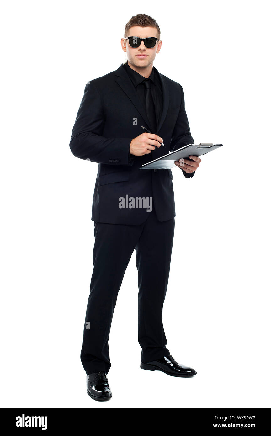 Male bouncer holding clipboard isolated against white background Stock