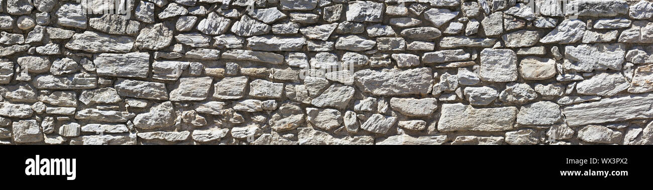 Rough stone wall in poster size Stock Photo