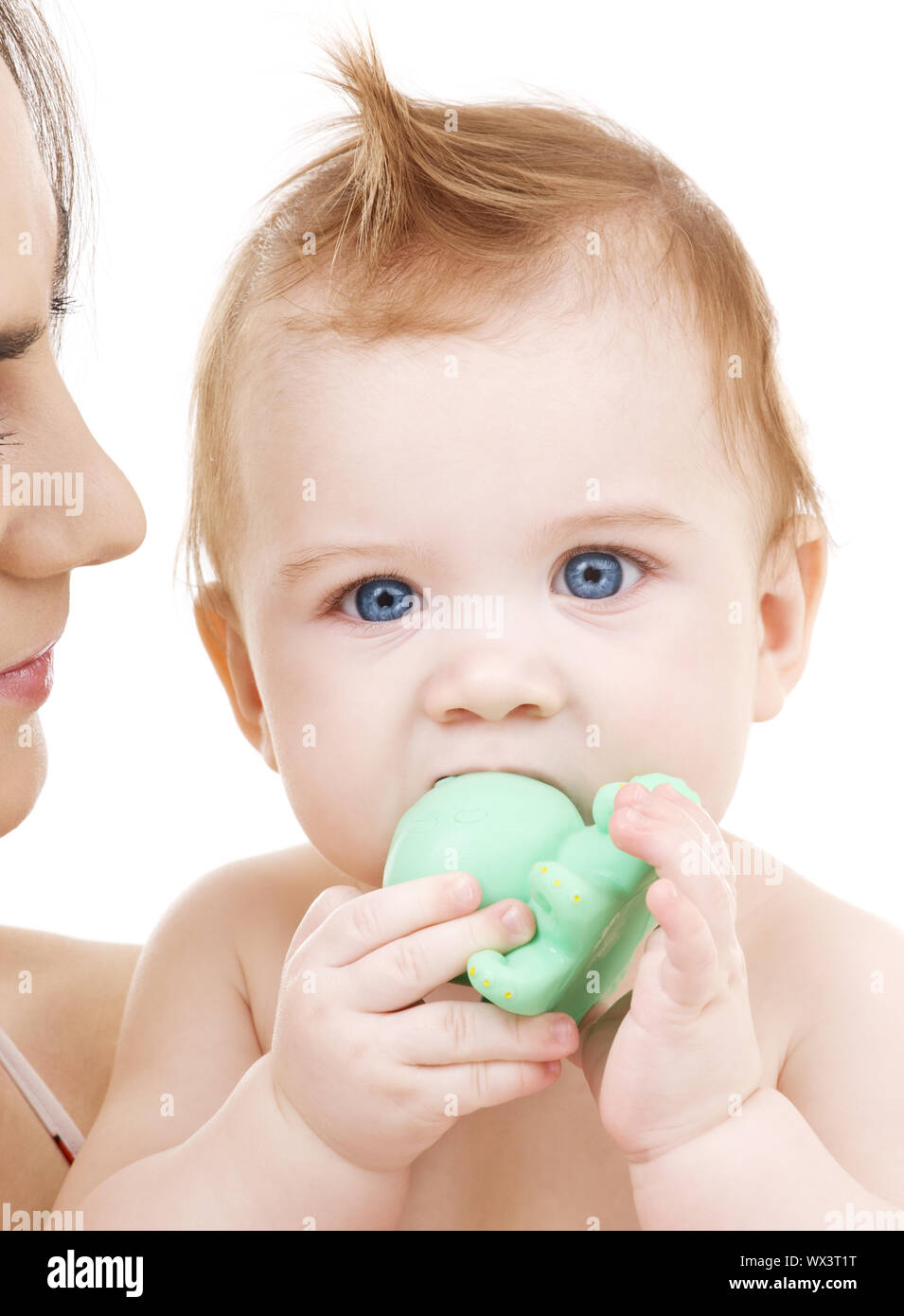 picture of baby boy with green plastic toy Stock Photo - Alamy