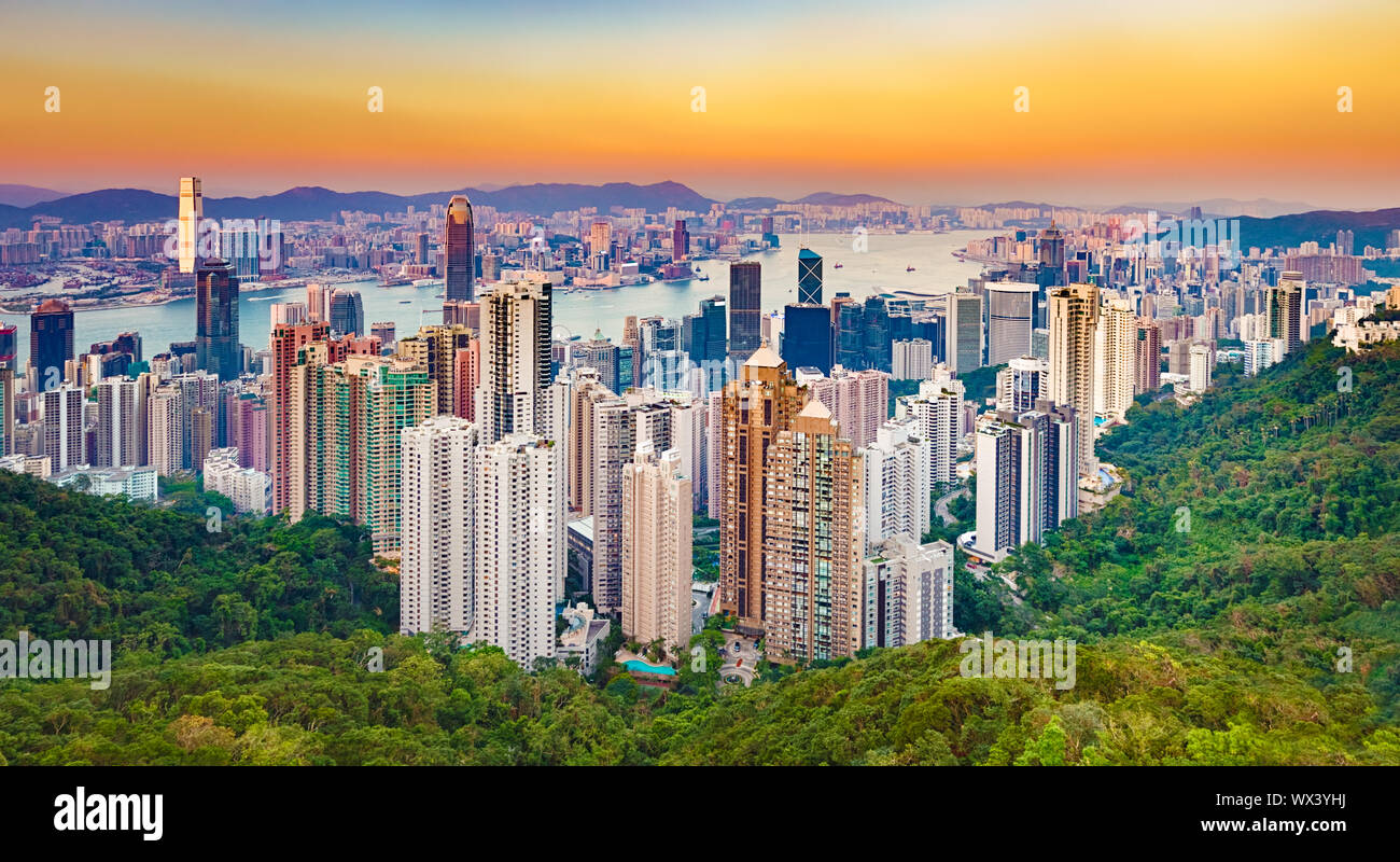 Hong Kong skyline at sunset. Panorama Stock Photo