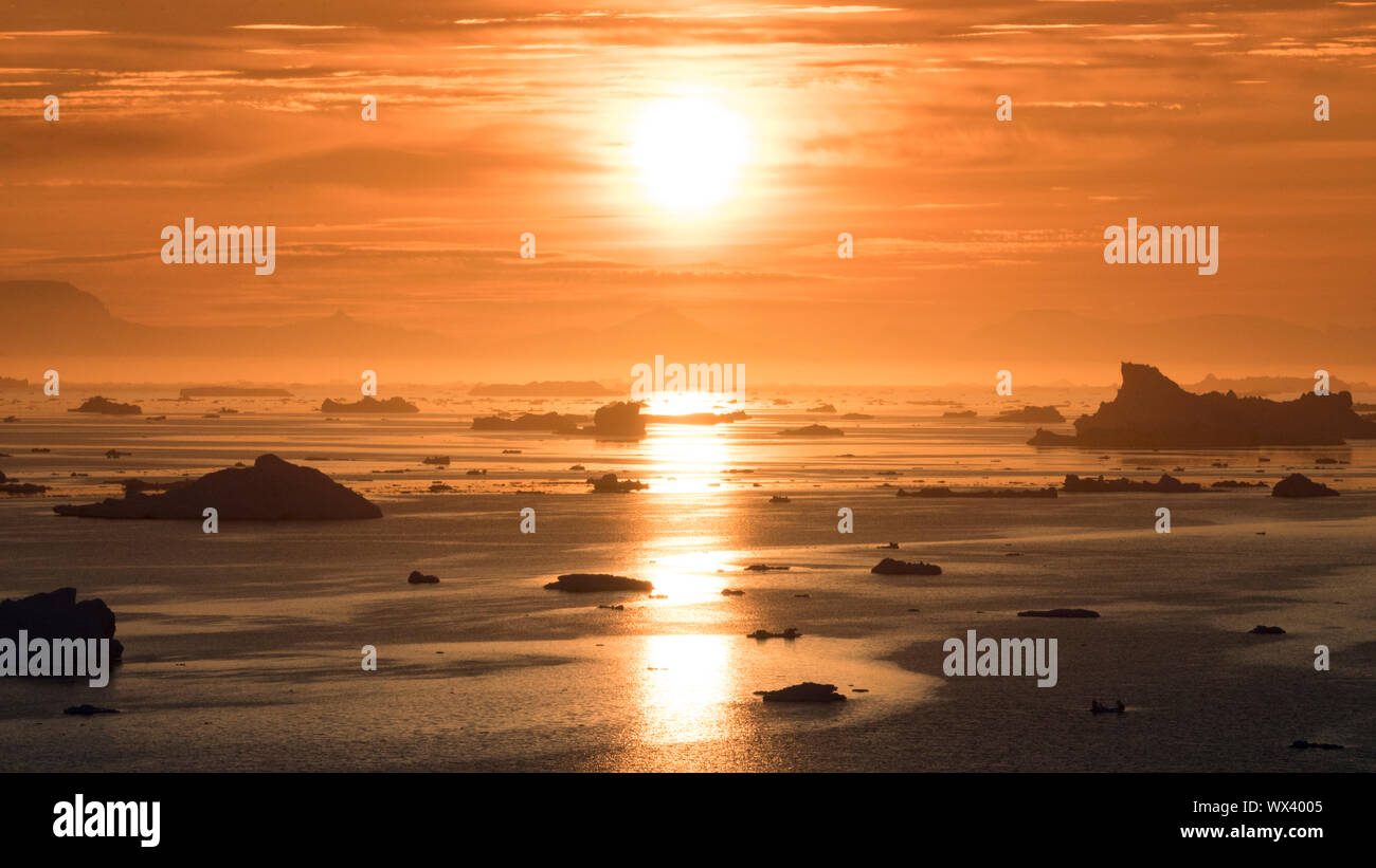 Sunbeam reflection on the arctic ocean in greenland Stock Photo