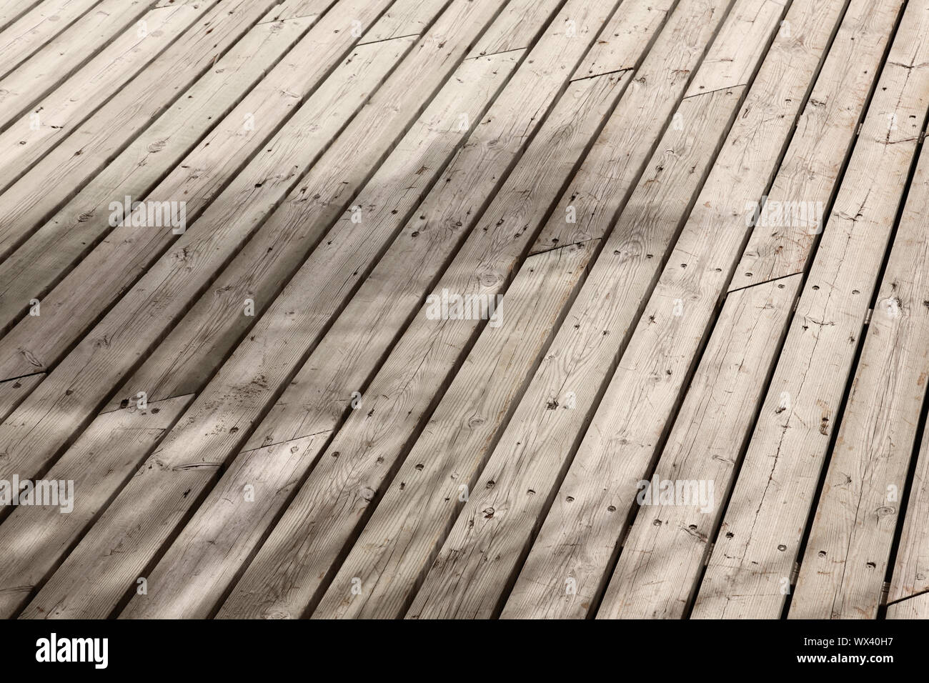 Rustic wood planks, with beautiful palm shadows Stock Photo