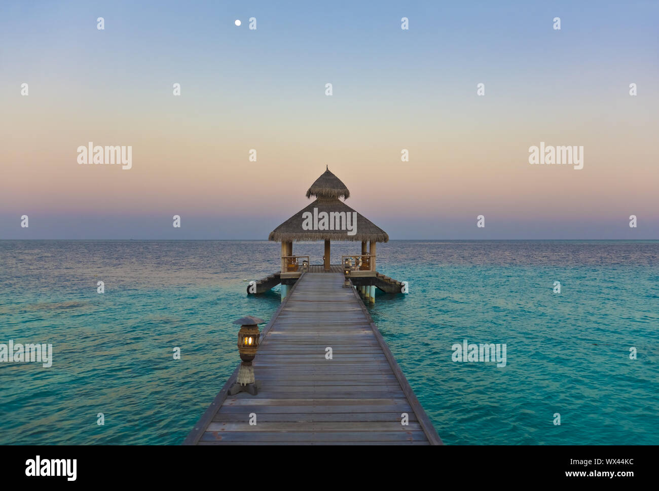 Jetty in the moonlight on the Maldives Stock Photo