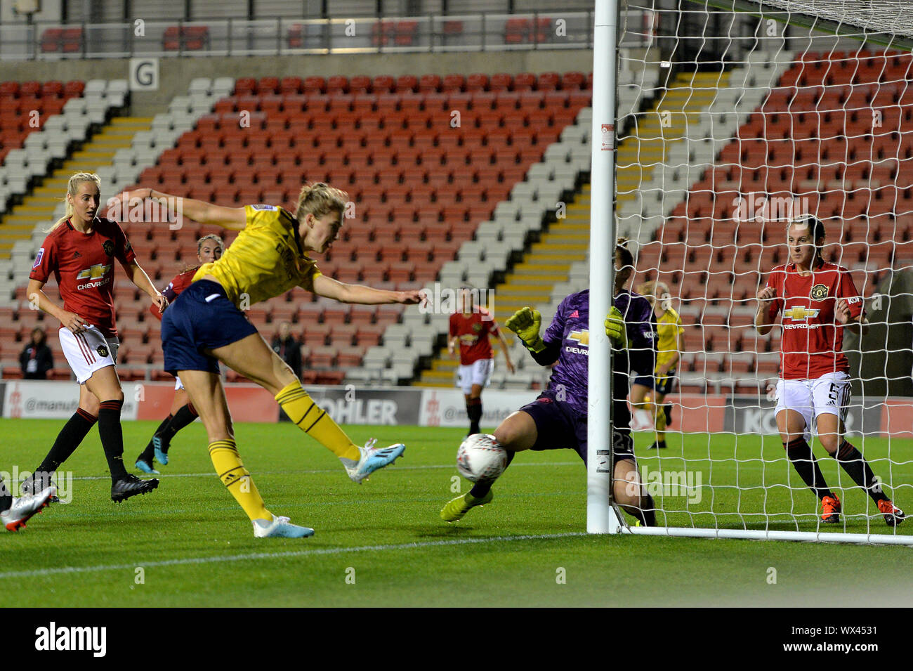 Arsenal's Vivianne Miedema sees her shot on goal saved by Manchester United's goalkeeper Mary Earps during the Barclays FA Women's Super League match at Leigh Sports Village, Leigh. Stock Photo