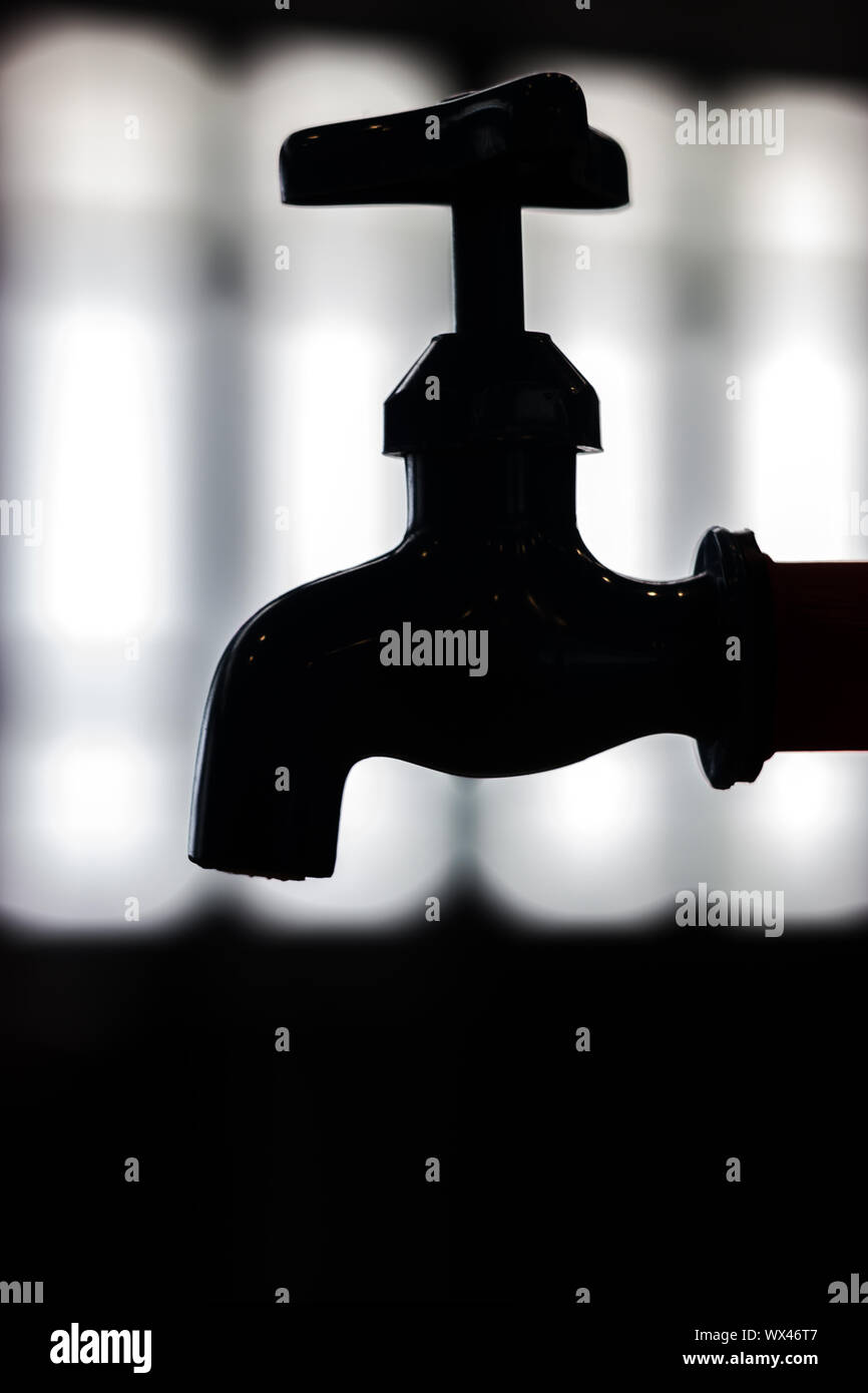 No water drop Faucet silhouette on window light, Save water environment