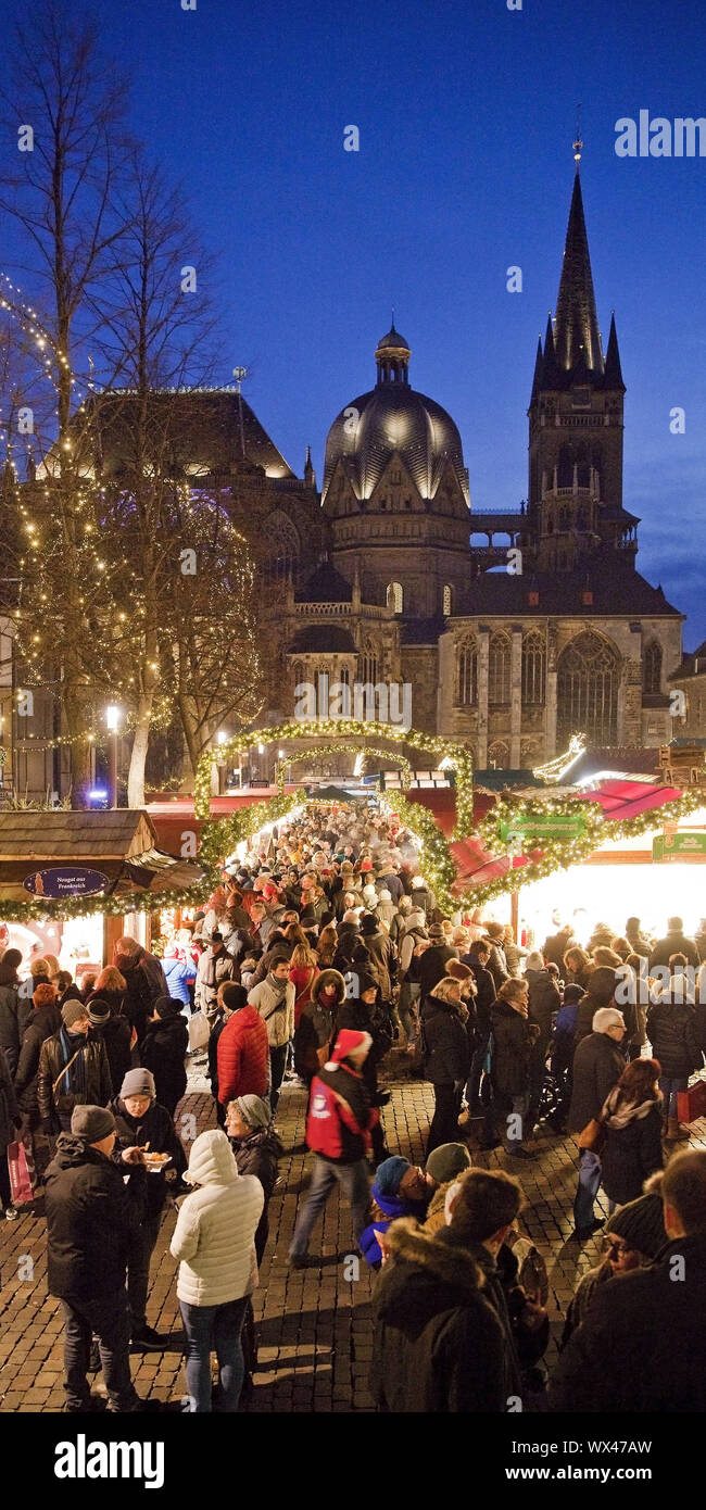 Many people at the Christmas market at Aachen Cathedral in the evening, Aachen, Germany, Europe Stock Photo
