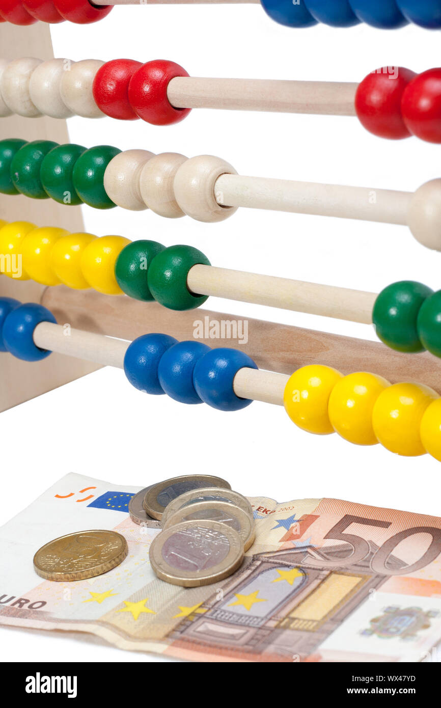 Close up of a colored children sliderule with money Stock Photo